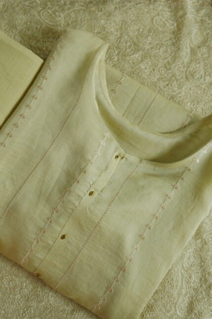 Semi-stitched kurti in a soft, pastel color with subtle embroidery along the neckline and front placket, suitable for festivals, traditional events, and stylish ethnic wear for women.