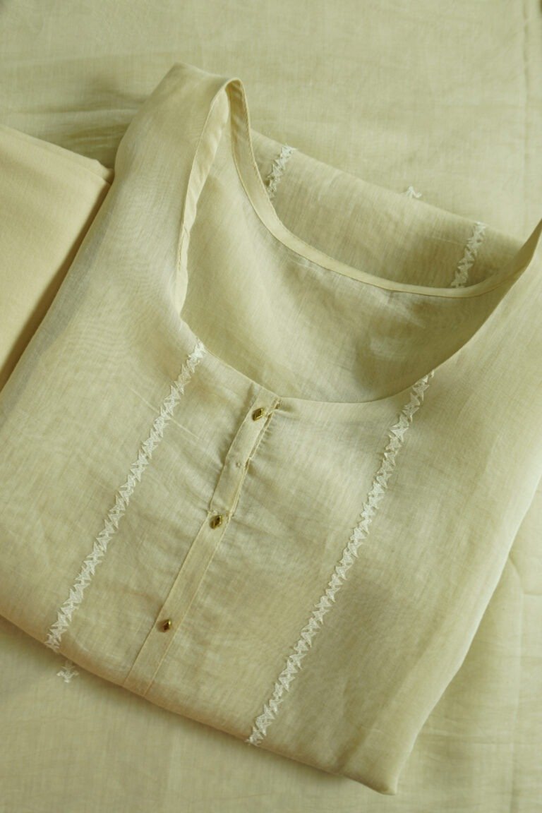 Semi-stitched kurti in a soft, light color with subtle embroidery along the neckline, suitable for festivals, traditional events, and stylish ethnic wear for women.