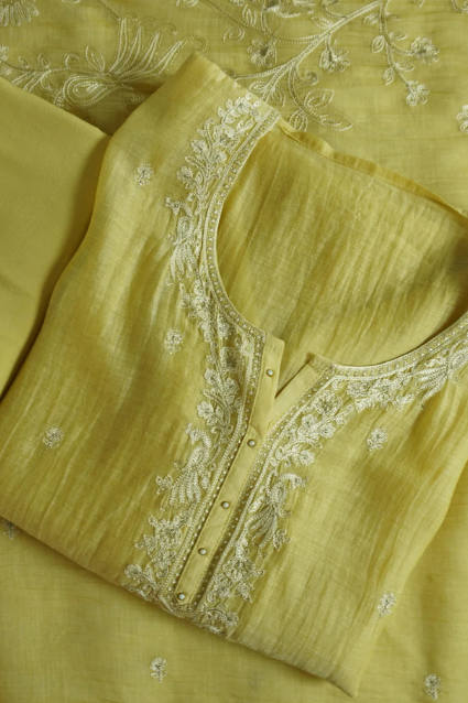 Harmony Tunic Yellow Harmony Tunic semi-stitched kurti with embroidered neckline, elegant design, and subtle detailing, ideal for festive and casual occasions.