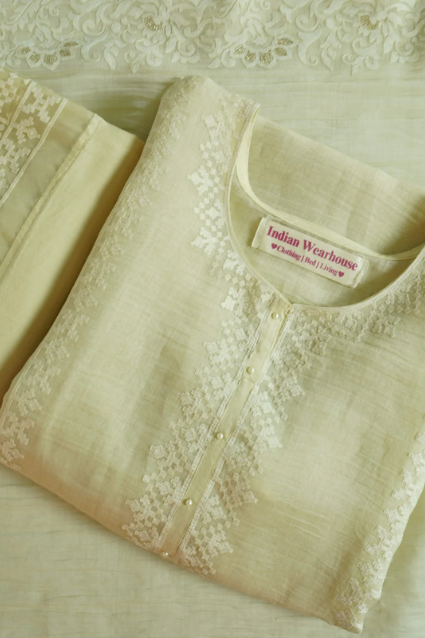Meherbano-Light-Cream-scaled Cream Meherbano semi-stitched kurti with detailed embroidery on neckline and front placket, suitable for festivals, casual outings, and special occasions.