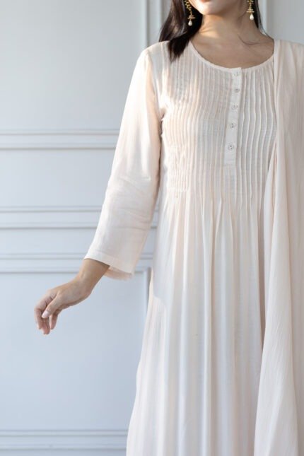 Close-up of earrings and neckline paired with Pavitra kurti