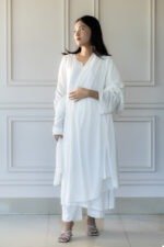 Woman wearing Sufaira white kurti with delicate lace detailing and matching dupatta – elegant ethnic fashion