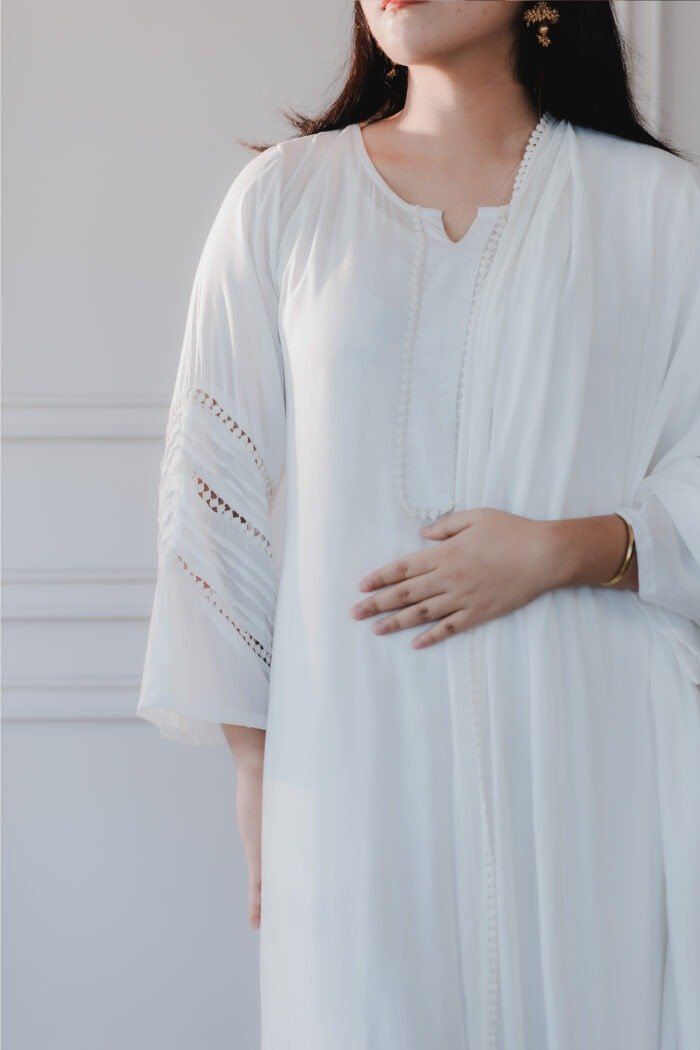 Close-up of Sufaira’s neckline and button detailing