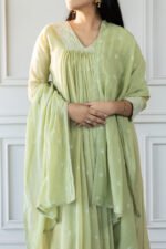 Model wearing embroidered kurti with dupatta styled elegantly.