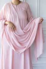 Woman wearing Sharvani blush pink kurti with draped dupatta
