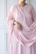 Close-up of Sharvani kurti’s pleated neckline and soft fabric texture