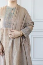 Close-up of Mrinala kurti’s silver and teal embroidered yoke