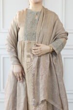 Woman wearing Mrinala taupe kurti with embroidered neckline and dupatta