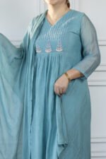 Side profile showing sheer sleeve and vertical threadwork