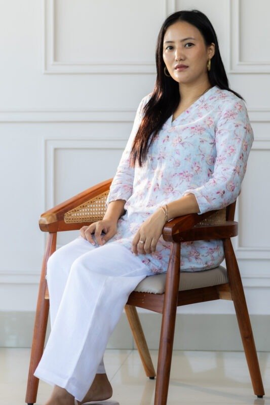 Seated pose with Lumi kurti styled casually, emphasizing comfort and elegance.