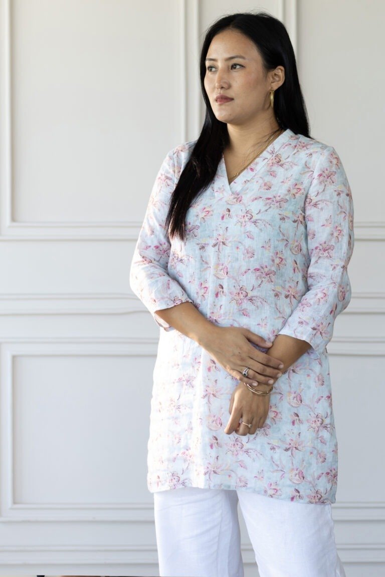 Side profile of model wearing Lumi kurti, showcasing sleeve length and relaxed fit.