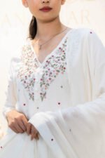 Side profile showing draped dupatta and flowing silhouette