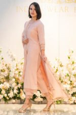 Side profile of model wearing Blush Raag, highlighting flow and fit