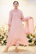 Model standing in boutique setting wearing Aangan Aura outfit