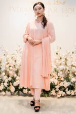 Full-length view of Tehzeeb Taraana peach kurti set with churidar and dupatta Full-length view of Tehzeeb Taraana peach kurti set with churidar and dupatta