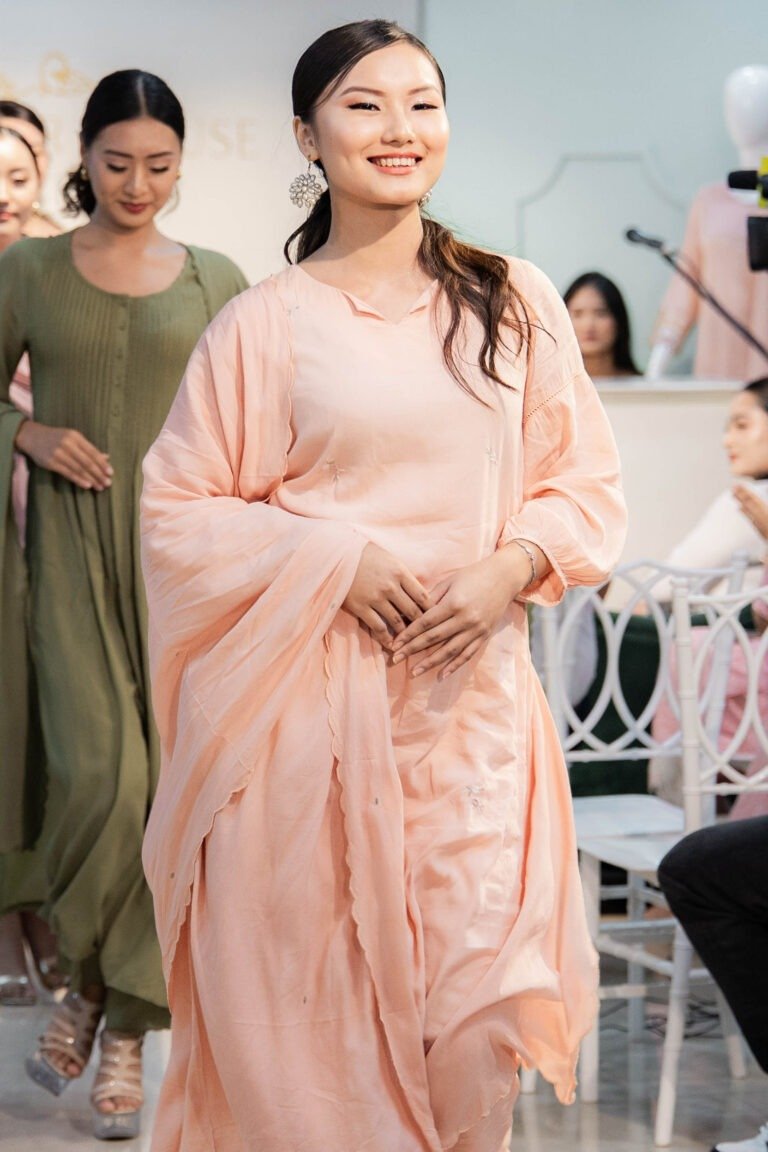 Model wearing Tehzeeb Taraana peach embroidered modal kurti set on runway with dupatta