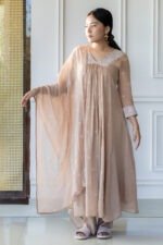 Full-length shot of GulBagh kurti styled with gold accessories
