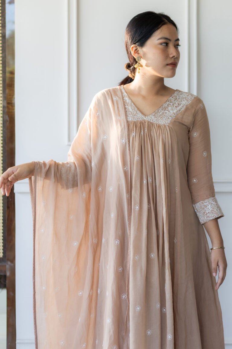 Detail of fabric texture and white thread motifs