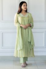 Side profile of embroidered kurti with dupatta and floral handwork.