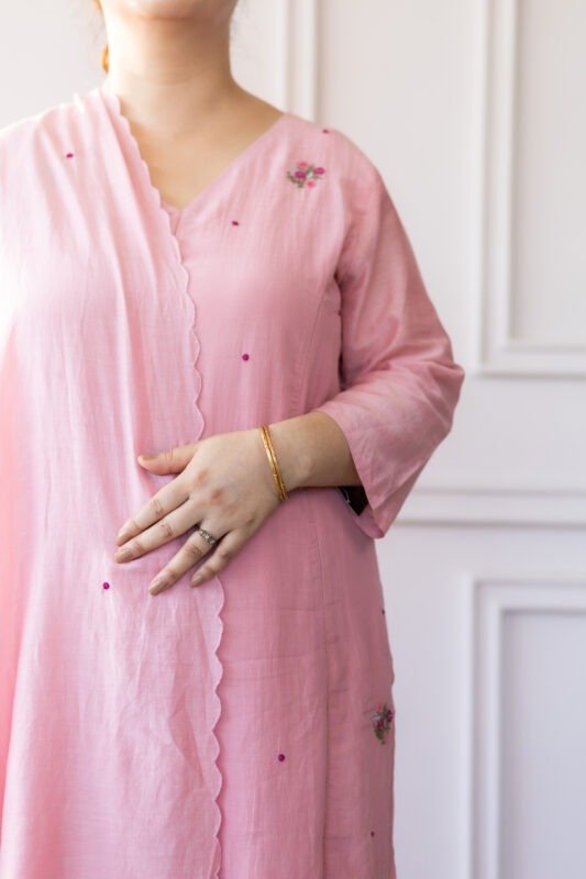 Close-up of Blushé’s embroidered floral motifs and neckline detailing