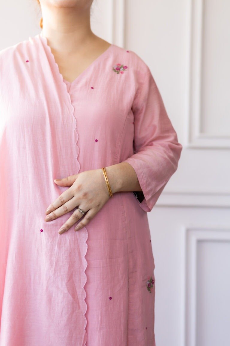 Close-up of Blushé’s embroidered floral motifs and neckline detailing