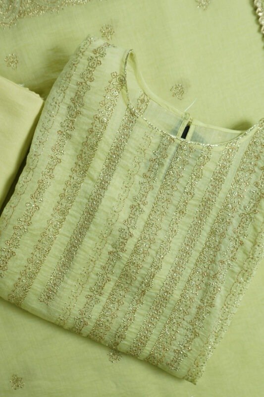 Light pistachio green semi-stitched kurti with golden zari embroidery, matching bottom fabric, and embroidered dupatta laid flat.