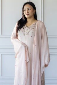 Woman wearing Sakura pastel embroidered kurti with dupatta – front pose