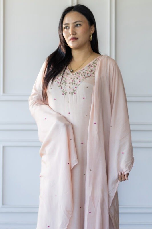 Woman wearing Sakura pastel embroidered kurti with dupatta – front pose