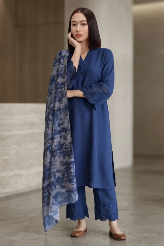 Full-length shot of the Vogue blue linen kurti set including straight-fit trousers and a decorative floral dupatta.