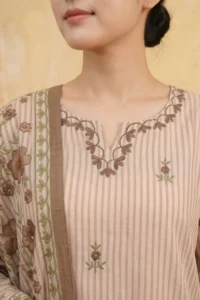 Close-up of the Mocha Bloom Kurta Set featuring a V-neckline with delicate brown vine and leaf threadwork embroidery and scattered small floral motifs on a pink and cream striped cotton fabric with a floral embroidered dupatta draped alongside