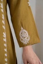 Detailed view of the Zoya kurti sleeve featuring a white paisley embroidery motif and fine fabric texture of the premium cotton silk blend.