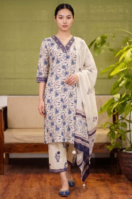 Full-length view of the Cerulean Print Kurti set, featuring delicate blue floral vine prints on a natural kora beige base, matched with bordered straight trousers and a softly draped dupatta.