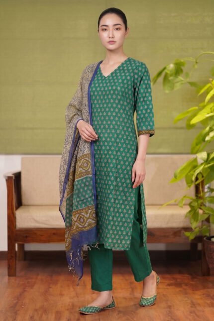 Full-length view of the Forest Flora kurti set, a green botanical print ensemble with matching pants and a contrast beige dupatta.