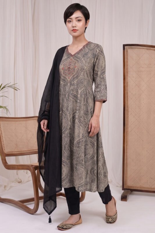 : Full-length view of the Graphite Mandala Kurti set, featuring an intricately printed grey and black A-line kurta, tailored solid black trousers, and a gracefully draped solid black dupatta with tassels.