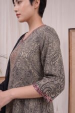 Detailed side angle of the Graphite Mandala Kurti showcasing the classic three-quarter sleeves finished with a contrasting colorful border, highlighting the highly detailed grey and black heritage print.