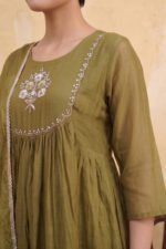 Detailed angled shot of the Olive Gathered Kurti showcasing the sheer three-quarter sleeves, the intricate neckline embroidery, and the flowing gathered silhouette.