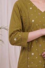Detailed side shot of the Olive Pintuck Kurti showcasing the three-quarter sleeves, which are elegantly finished with matching pintucks and delicate lace bands to perfectly complement the embroidered bodice.
