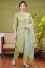 Full-length view of a women's pistachio green ethnic set featuring a floral print kurta, matching trousers, and a printed kota doria dupatta.