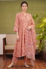 Full-length shot of the Sage Fern kurti set, featuring a peach-toned Anarkali with orange floral motifs, matching trousers, and a coordinating printed dupatta.