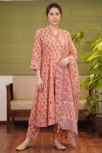 Full-length shot of the Sage Fern kurti set, featuring a peach-toned Anarkali with orange floral motifs, matching trousers, and a coordinating printed dupatta.