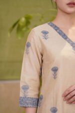 Detailed shot of the Slate Print Kurti showcasing the three-quarter sleeve finished with a wide patterned cuff border, highlighting the classic muted blue floral block prints.