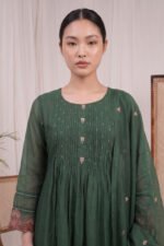 Close-up of the Verdant Flora Kurti highlighting the detailed front pintucks, round neckline, and delicate embroidered motifs on the dark green bodice.