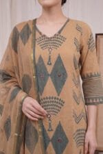 Detailed close-up of the Oasis Print Kurti showcasing the V-neckline with delicate contrast stitching. The perfectly aligned yoke features prominent slate-green diamond motifs accented with intricate circular mirror work, paired with a draped dupatta showing a subtle metallic border.