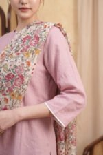 A close-up of the dusty pink Loom Kurti sleeve showing the high-quality finish and the clean white contrast piping at the cuff.